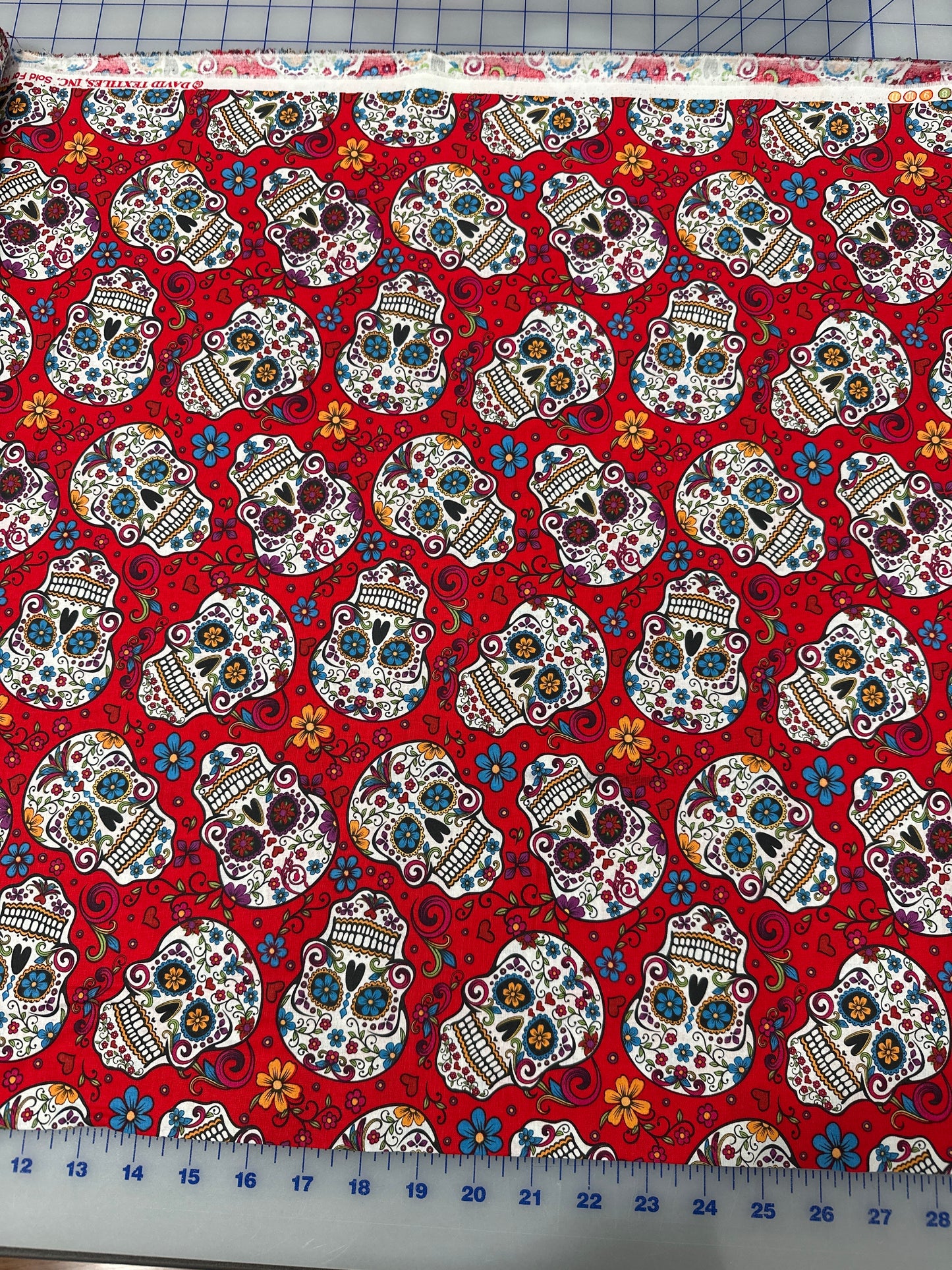 Folkloric Skulls in Red by David Textiles